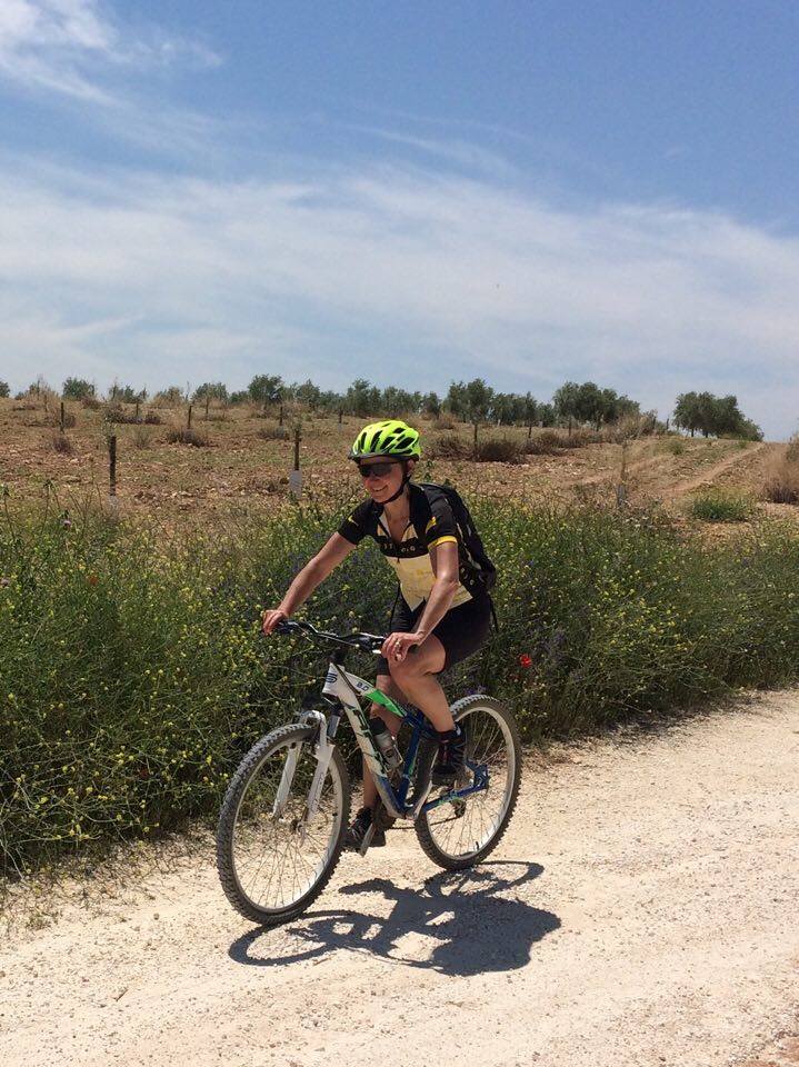 Mountain biking through olive groves